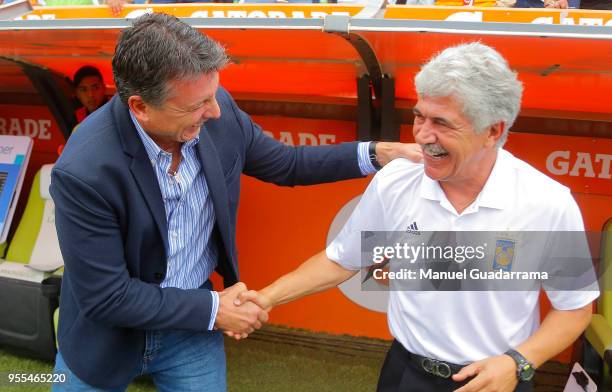 Robert Siboldi, coach of Santos greets Ricardo Ferretti, coach of Tigres during the quarter finals second leg match between Santos Laguna and Tigres...