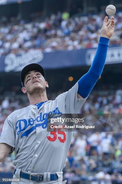 Cody Bellinger of Los Angeles Dodgers throws a ball to the fans at the end of the third inning during the MLB game against the San Diego Padres at...