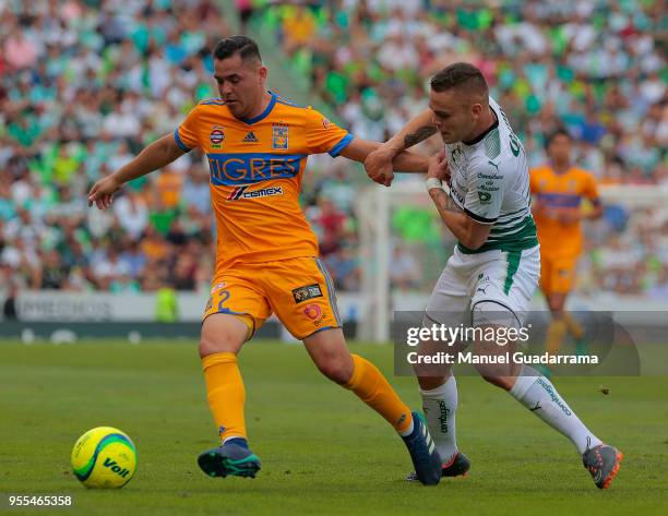 Israel Jimenez of Tigres and Jonathan Rodriguez of Santos fights for the ball during the quarter finals second leg match between Santos Laguna and...