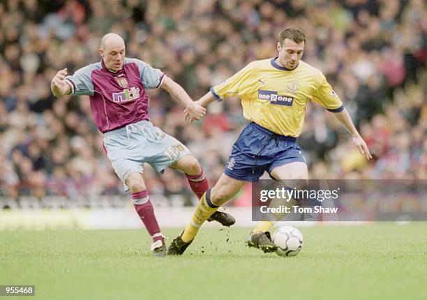 David Unsworth of Everton is challenged by Steve Stone of Aston Villa during the FA Carling Premiership match at Villa Park in Birmingham, England....