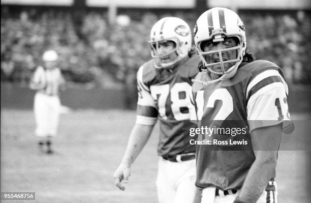 Joe Namath, NY Jets Quarterback, walks off the field during a game with the Miami Dolphins at Shea Stadium on Nov. 24, 1974 in Queens, New York.