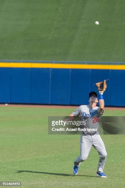 Right fielder Chase Utley of Los Angeles Dodgers, catches a hit by third baseman Christian Villanueva of San Diego Padres in the seventh inning...