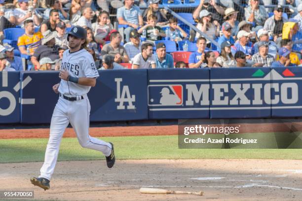 Center fielder Travis Jankowski of San Diego Padres gets home after a hit by center fielder Franchy Cordero in the seventh inning during the MLB...