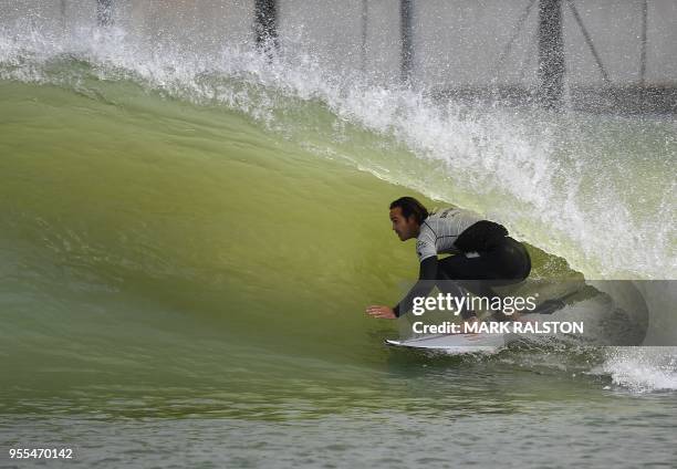 Jordy Smith of South Africa in the tube as he leads the World Team to victory in the final of the WSL Founders' Cup of Surfing at the Kelly Slater...