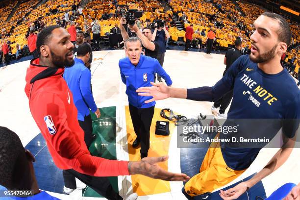 Referee official Ken Mauer speaks to team captains Tarik Black of the Houston Rockets and Rudy Gobert of the Utah Jazz before tip off during Game...