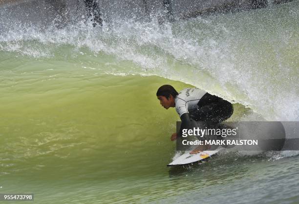 Kanoa Igarashi of Japan and surfing for the World Team in the tube before his team won the final of the WSL Founders' Cup of Surfing, at the Kelly...
