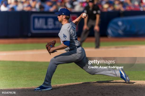 Relief pitcher Brock Stewart of the Los Angeles Dodgers pitches in the eight inning during the MLB game against the San Diego Padres at Estadio de...