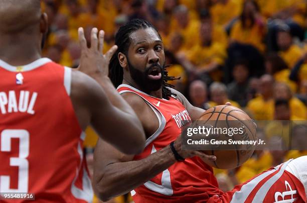 Nene Hilario of the Houston Rockets looks to pass to teammate Chris Paul in the first half during Game Four of Round Two of the 2018 NBA Playoffs...