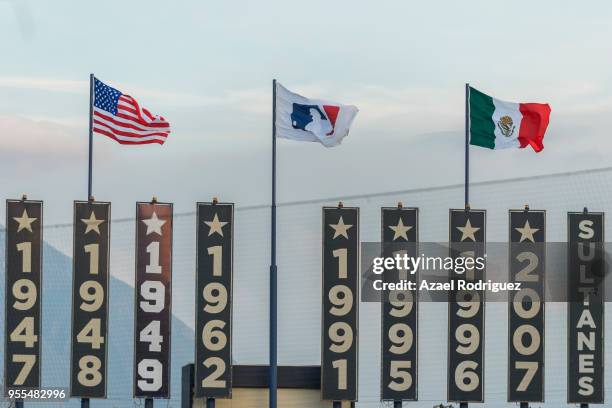 The flags of USA, MLB and Mexico wave at the end of the MLB game between the San Diego Padres and the Los Angeles Dodgers at Estadio de Beisbol...