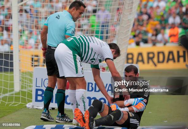 Nahuel Guzman of Tigres lies on the ground after being injured during the quarter finals second leg match between Santos Laguna and Tigres UANL as...