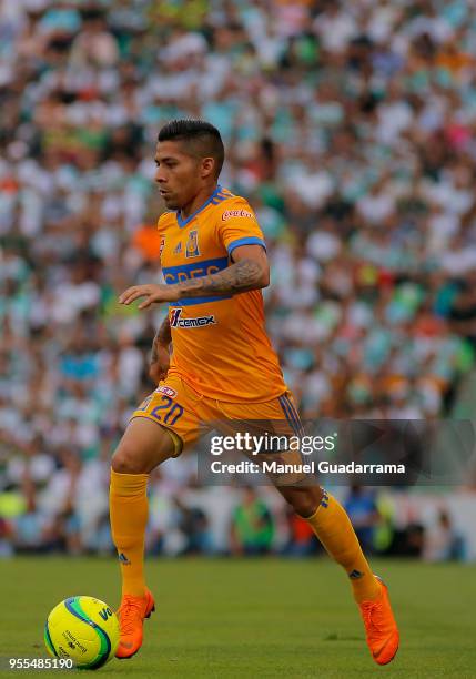 Javier Aquino of Tigres drives the ball during the quarter finals second leg match between Santos Laguna and Tigres UANL as part of the Torneo...