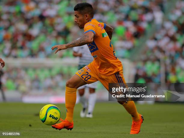 Javier Aquino of Tigres drives the ball during the quarter finals second leg match between Santos Laguna and Tigres UANL as part of the Torneo...