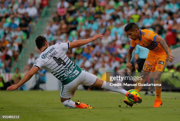 Javier Aquino of Tigres and Jorge Sanchez of Santos fight for the ball during the quarter finals second leg match between Santos Laguna and Tigres...