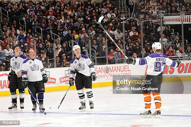 Luc Robitaille and Jeremy Roenik stand on the ice prior to the Face-Off for Hope charity game benefiting City of Hope following the game between the...