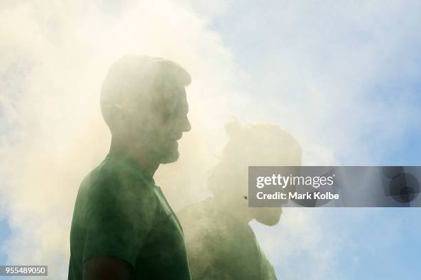 Josh Risdon and Josh Brillante pose in smoke during a photo shoot after the Australian Socceroos World Cup Preliminary Squad Announcement at Lady...