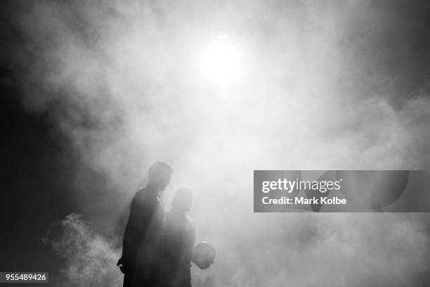 Josh Risdon and Josh Brillante pose in smoke during a photo shoot after the Australian Socceroos World Cup Preliminary Squad Announcement at Lady...