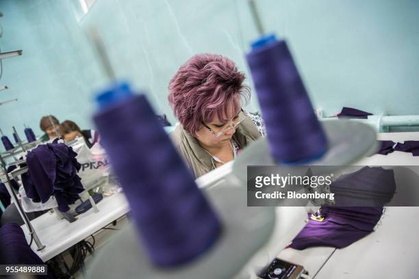 Worker operates a sewing machine at an Alinex garment factory in Bishkek, Kyrgyzstan, on Wednesday, April 18, 2018. The Kyrgyz Republic ranked 77th...