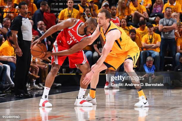 Chris Paul of the Houston Rockets handles the ball against Joe Ingles of the Utah Jazz during Game Four of the Western Conference Semifinals of the...