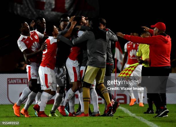 Jose Moya of Independiente Santa Fe celebrates with teammates after scoring the first goal of his team during a match between Independiente Santa Fe...