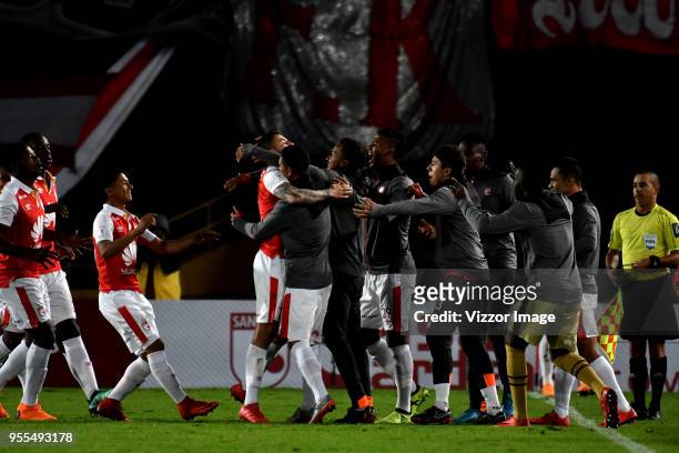 Jose Moya of Independiente Santa Fe celebrates with teammates after scoring the first goal of his team during a match between Independiente Santa Fe...