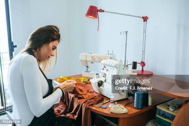 woman sewing in sewing workshop - costura stock pictures, royalty-free photos & images