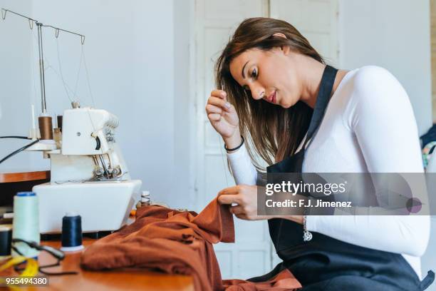 woman seamstress sewing with needle - costura stock pictures, royalty-free photos & images