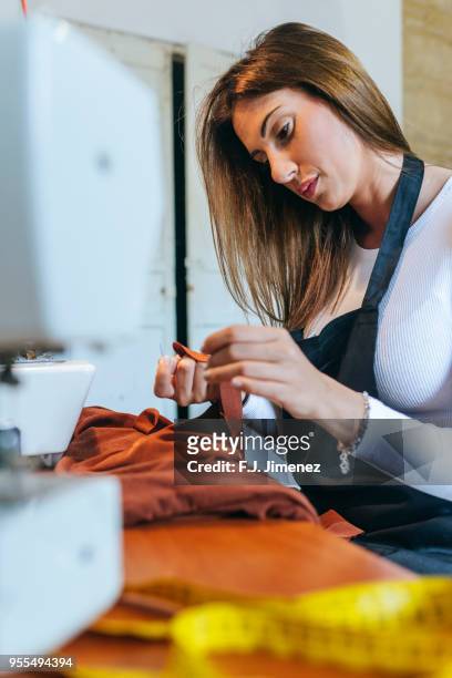 woman sewing in sewing workshop - costura stock pictures, royalty-free photos & images