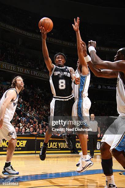 Roger Mason Jr. #8 of the San Antonio Spurs shoots against Dominic McGuire of the Washington Wizards at the Verizon Center on January 2, 2010 in...