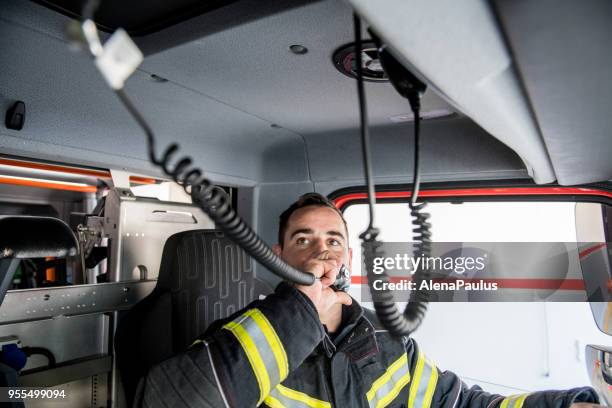 firefighter driving - emergency call - red panic button stock pictures, royalty-free photos & images