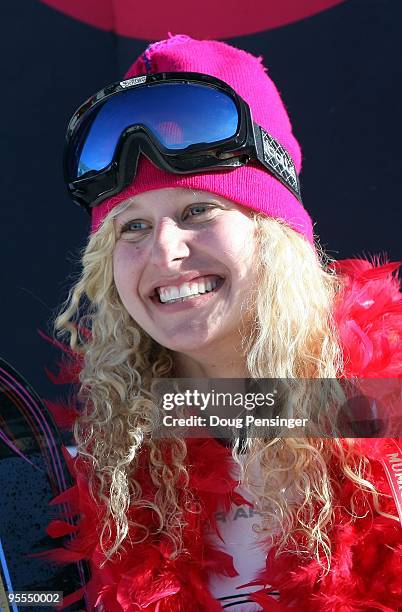 Lindsey Jacobellis of the USA takes the podium after winning the Women's FIS Snowboardcross Team World Cup with teammate Faye Gulini on December 20,...