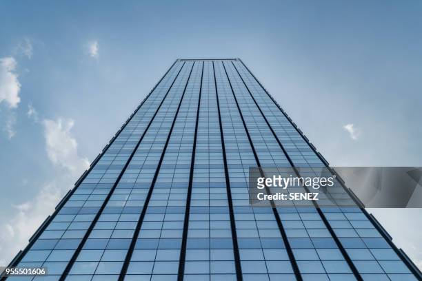 low angle view of skyscrapers - rascacielos fotografías e imágenes de stock