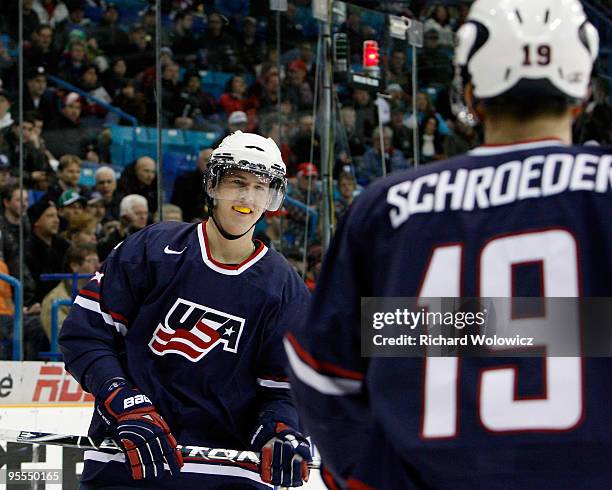 Matt Donovan celebrates his first period goal with Jordan Schroeder of Team USA during the 2010 IIHF World Junior Championship Tournament game...