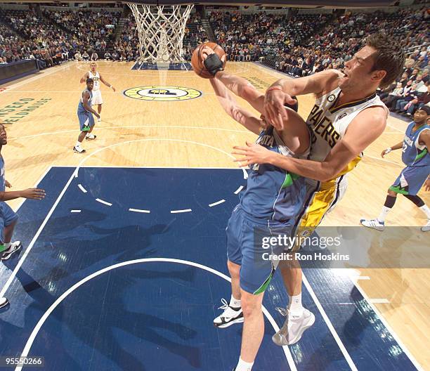 Josh McRoberts of the Indiana Pacers battles Kevin Love of the Minnesota Timberwolves at Conseco Fieldhouse on January 2, 2010 in Indianapolis,...