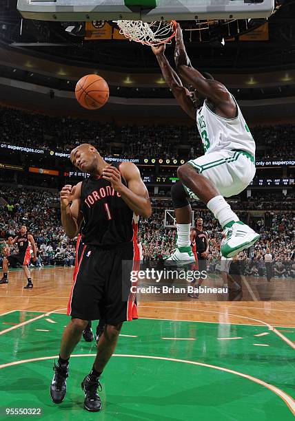 Kendrick Perkins of the Boston Celtics dunks the ball during the game against the Toronto Raptors on January 2, 2010 at the TD Garden in Boston,...