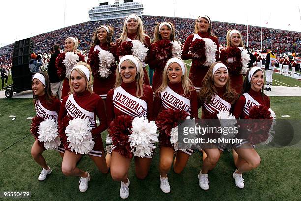 Cheerleaders of the Arkansas Razorbacks perform against the East Carolina Pirates during the 51st Annual Autozone Liberty Bowl on January 2, 2010 at...