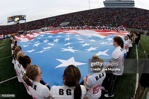 The American Flag is displayed prior to the game between the Arkansas Razorbacks and the East Carolina Pirates during the 51st Annual Autozone...