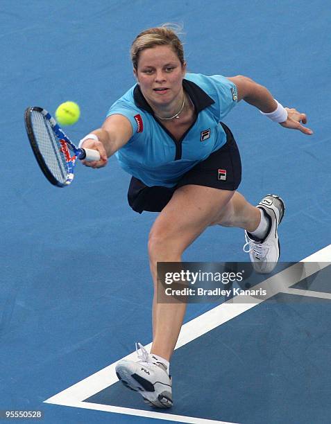 Kim Clijsters of Belgium plays a forehand in her first round match against Tathiana Garbin of Italy during day one of the Brisbane International 2010...