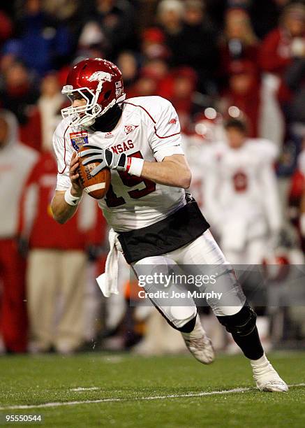 Ryan Mallett of the Arkansas Razorbacks scrambles against the East Carolina Pirates during the 51st Annual Autozone Liberty Bowl on January 2, 2010...