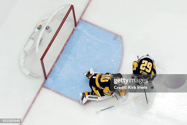 Carl Hagelin of the Pittsburgh Penguins checks on Matt Murray after he was shaken up while making a save in Game Four of the Eastern Conference...