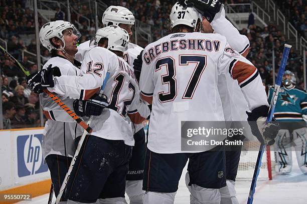 Denis Grebeshkov and Robert Nilsson of the Edmonton Oilers celebrate a goal during an NHL game against the San Jose Sharks on January 2, 2010 at HP...