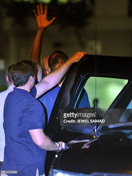 President Barack Obama waves as he leaves Lucky's Grill & Bar after having dinner in Kailua, Hawaii, on January 2, 2010. Obama on January 4, 2009...