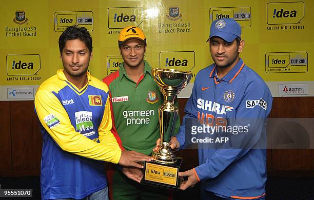 Sri Lankan cricket captain Kumar Sangakkara , Bangladeshi cricket captain Shakib al Hasan and Indian cricket captain Mahendra Singh Dhoni pose with...
