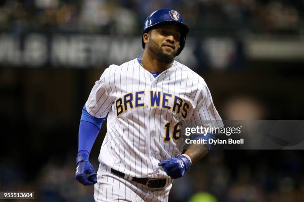 Domingo Santana of the Milwaukee Brewers rounds the bases after hitting a home run in the sixth inning against the Pittsburgh Pirates at Miller Park...