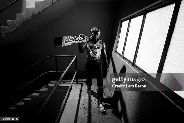 Eric Frenzel of Germany walks up to the hill prior to the Ski Jumping event of the FIS Nordic Combined World Cup at the Hans-Renner-Schanze on...