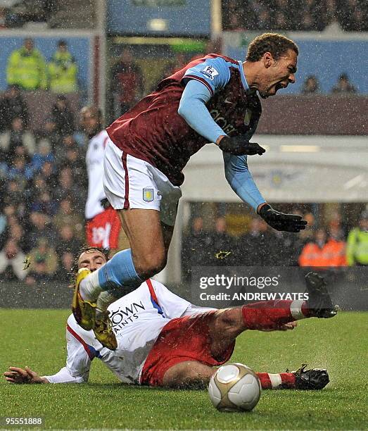 Aston Villa's Norwegian forward John Carew is fouled for a penalty by Blackburn Rovers' French defender Gael Givet during the FA Cup third round...