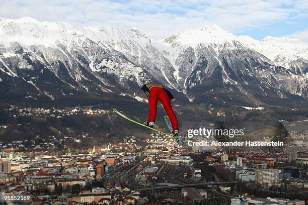 Andreas Kofler of Austria soars towards the Nordkette mountains during qualification round of the FIS Ski Jumping World Cup event of the 58th Four...