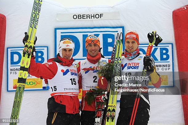 Felix Gottwald of Austria, Johnny Spillane of the USA and Bjoern Kircheisen of Germany on the podium after the Gundersen 10km Cross Country event...