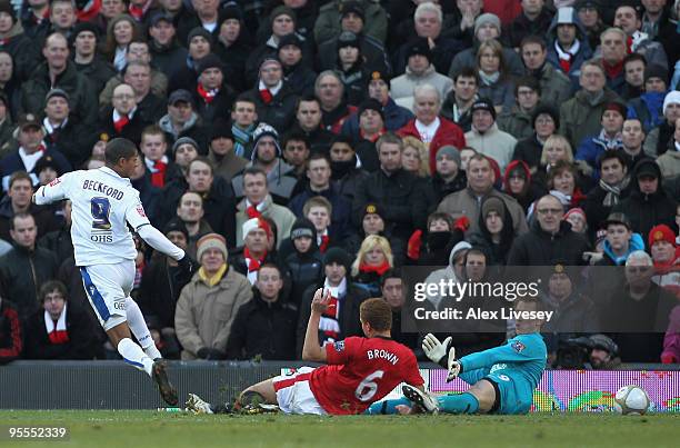 Tomasz Kuszczak and Wes Brown of Manchester United are unable to stop Jermaine Beckford of Leeds United scoring the opening goal during the FA Cup...