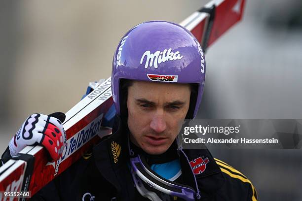 Martin Schmitt of Germany looks on after first round of the FIS Ski Jumping World Cup event of the 58th Four Hills ski jumping tournament on January...