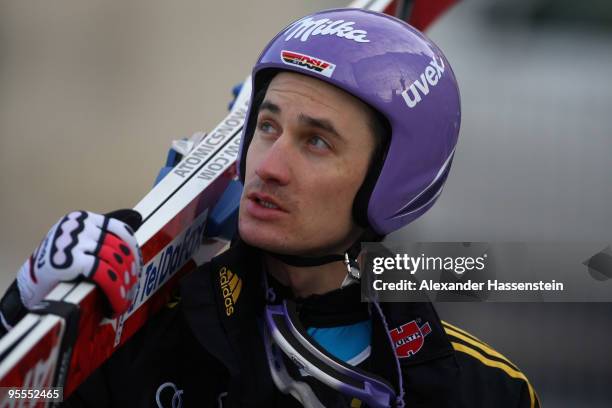 Martin Schmitt of Germany looks on after first round of the FIS Ski Jumping World Cup event of the 58th Four Hills ski jumping tournament on January...